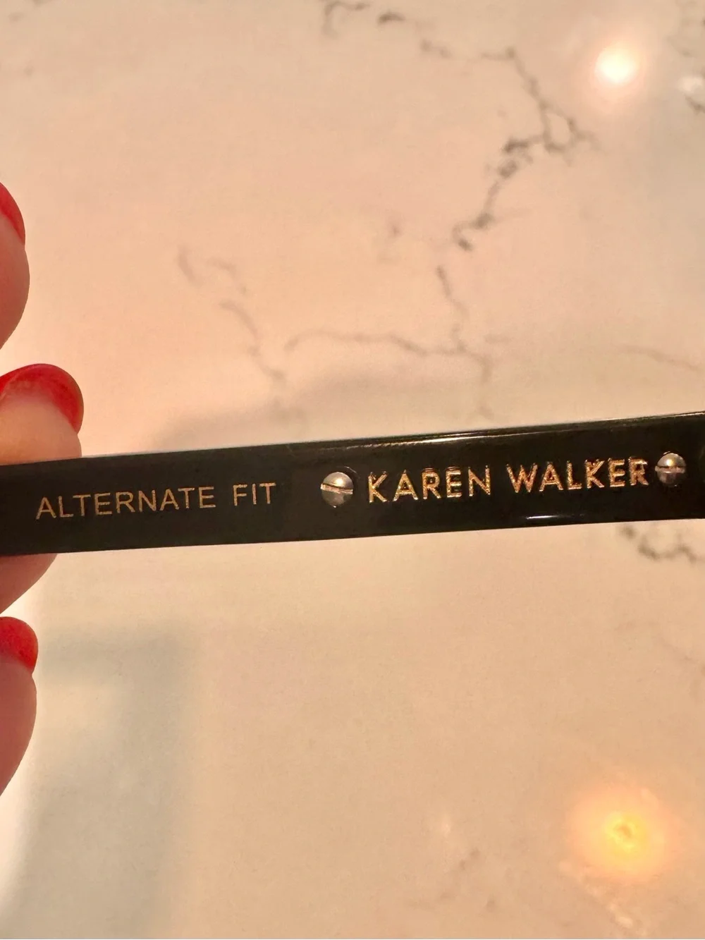 Karen Walker Black Round Sunglasses with Gold Detail and Purple Tint Lenses